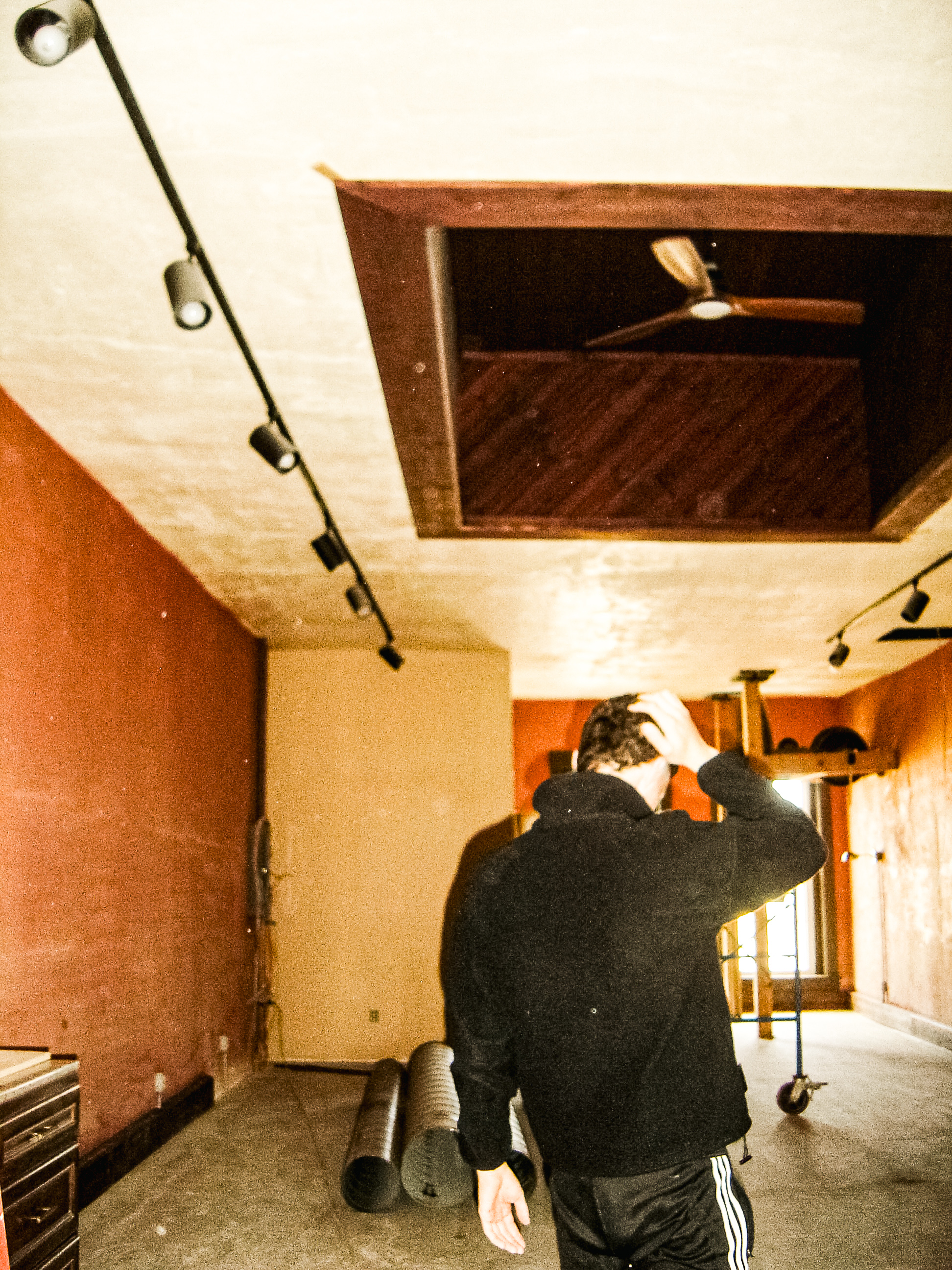 1BANDPASS in an unfinished interior corridor