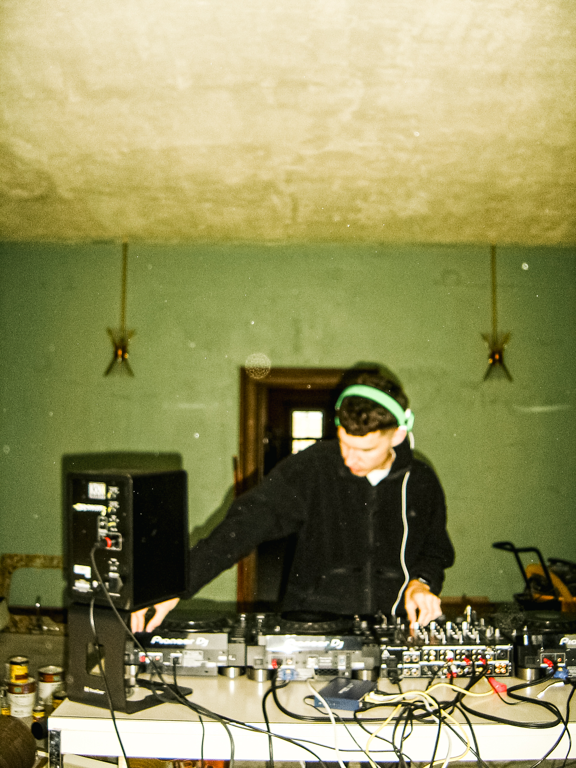1BANDPASS DJing at a table of decks and cables